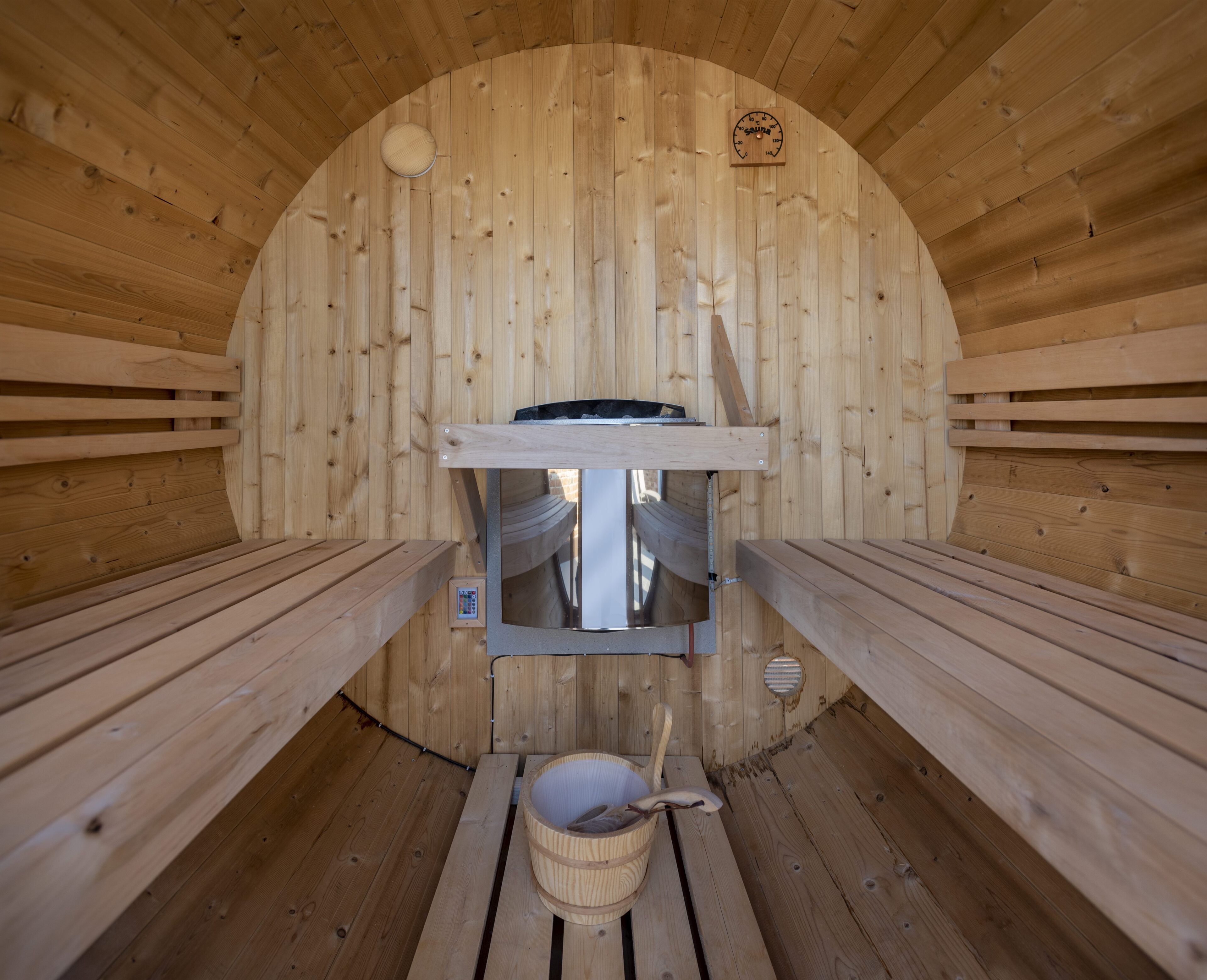 A sauna with wooden walls and benches.