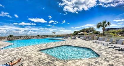 Ocean Front Condo with Resort Amenities, Short Walk to Beach