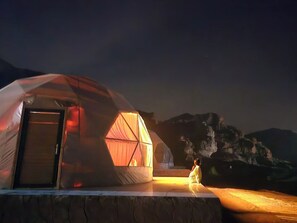 A geodesic dome tent with a door and a smaller attached structure with a curtain. - wadi rum  al omar (Wadi Rum)