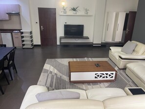 Deluxe Apartment, City View | Living area | 55-inch LED TV with cable channels - Rankset Guesthouse apartment (Addis Ababa)