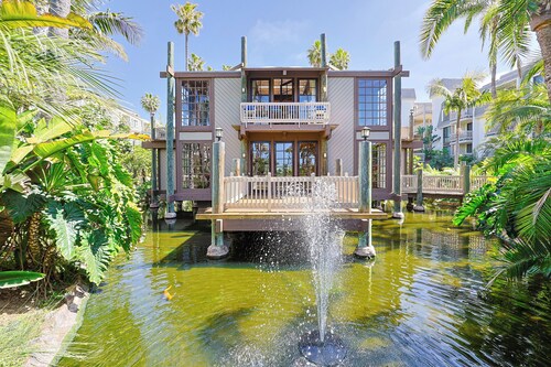 Serene NCV Beach Condo with Verdant Gardens & Ocean Glimpses!