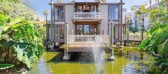 Serene NCV Beach Condo with Verdant Gardens & Ocean Glimpses!