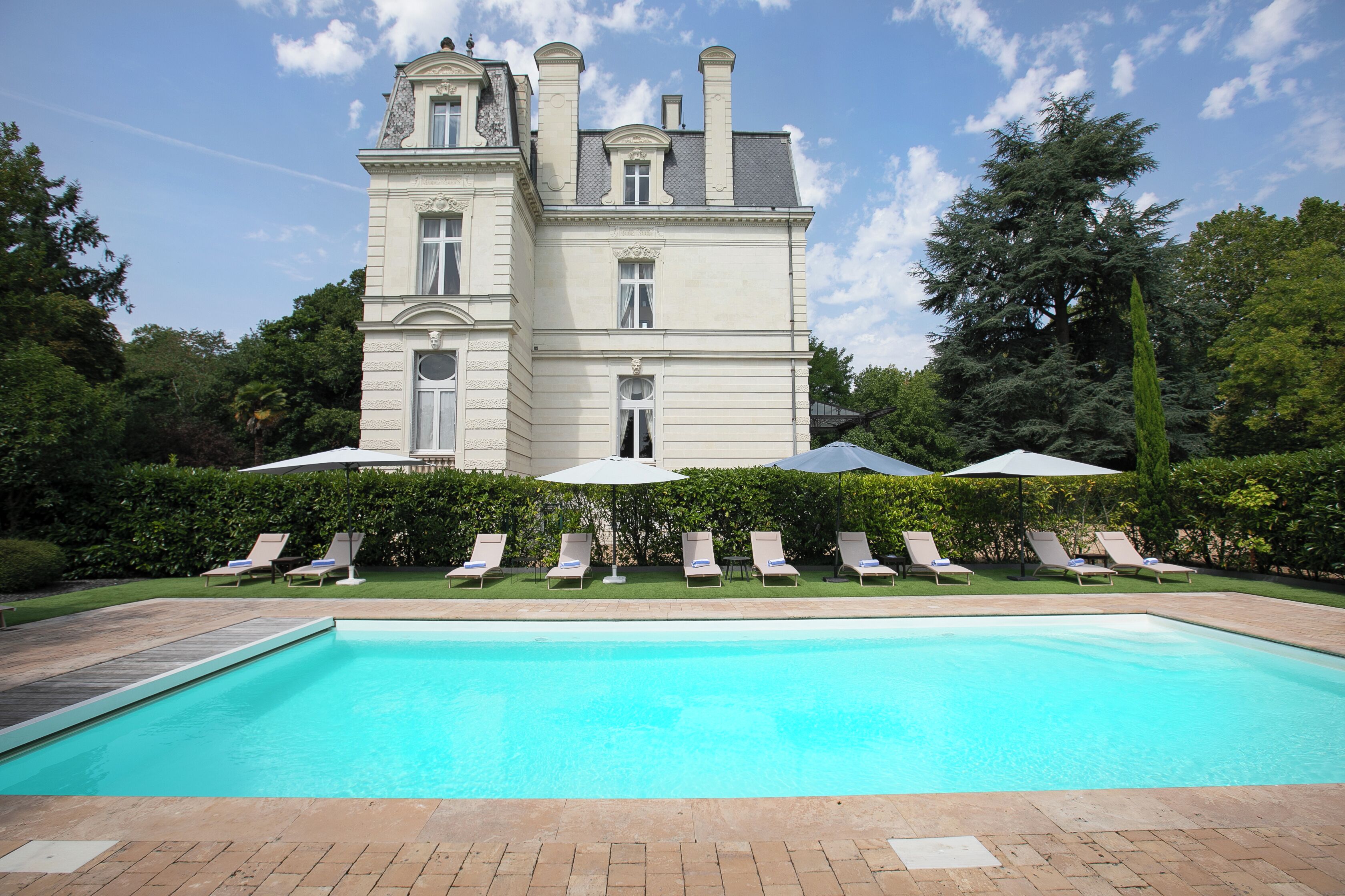 Seasonal outdoor pool, open 9:00 AM to 9:00 PM, pool umbrellas