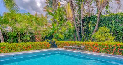 Colorful, dog-friendly home with private pool, W/D, & lush setting