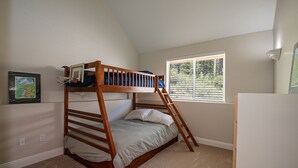 A bunk bed in a room with a window, carpeted floor, and a white wall. - Donner Lake, Home | Walk to the Lake, Trails, & Family Activities (Truckee)