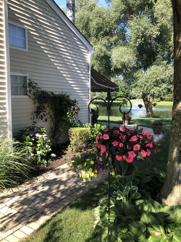 Eastern Long Island  gated community  condo on a pond with resort style pool
