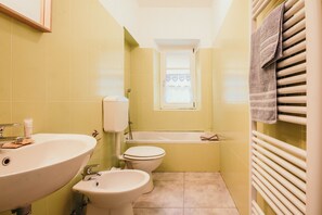 Bathtub, hair dryer, towels