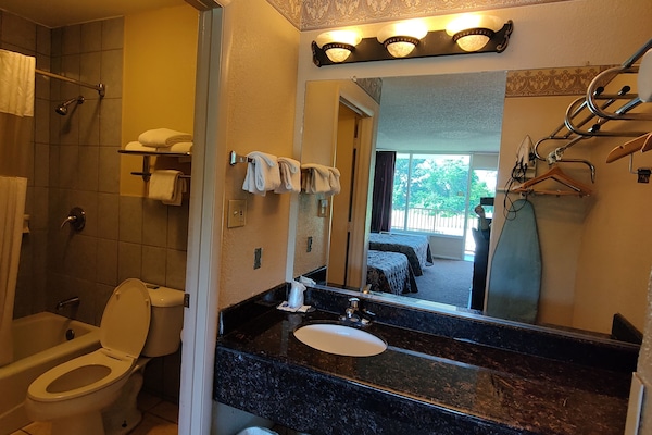 Standard Room, 2 Double Beds, Non Smoking | Bathroom | Combined shower/tub, hair dryer, towels
