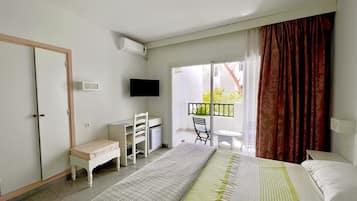 Deluxe Double Room, Garden Area | Minibar, desk, laptop workspace, bed sheets