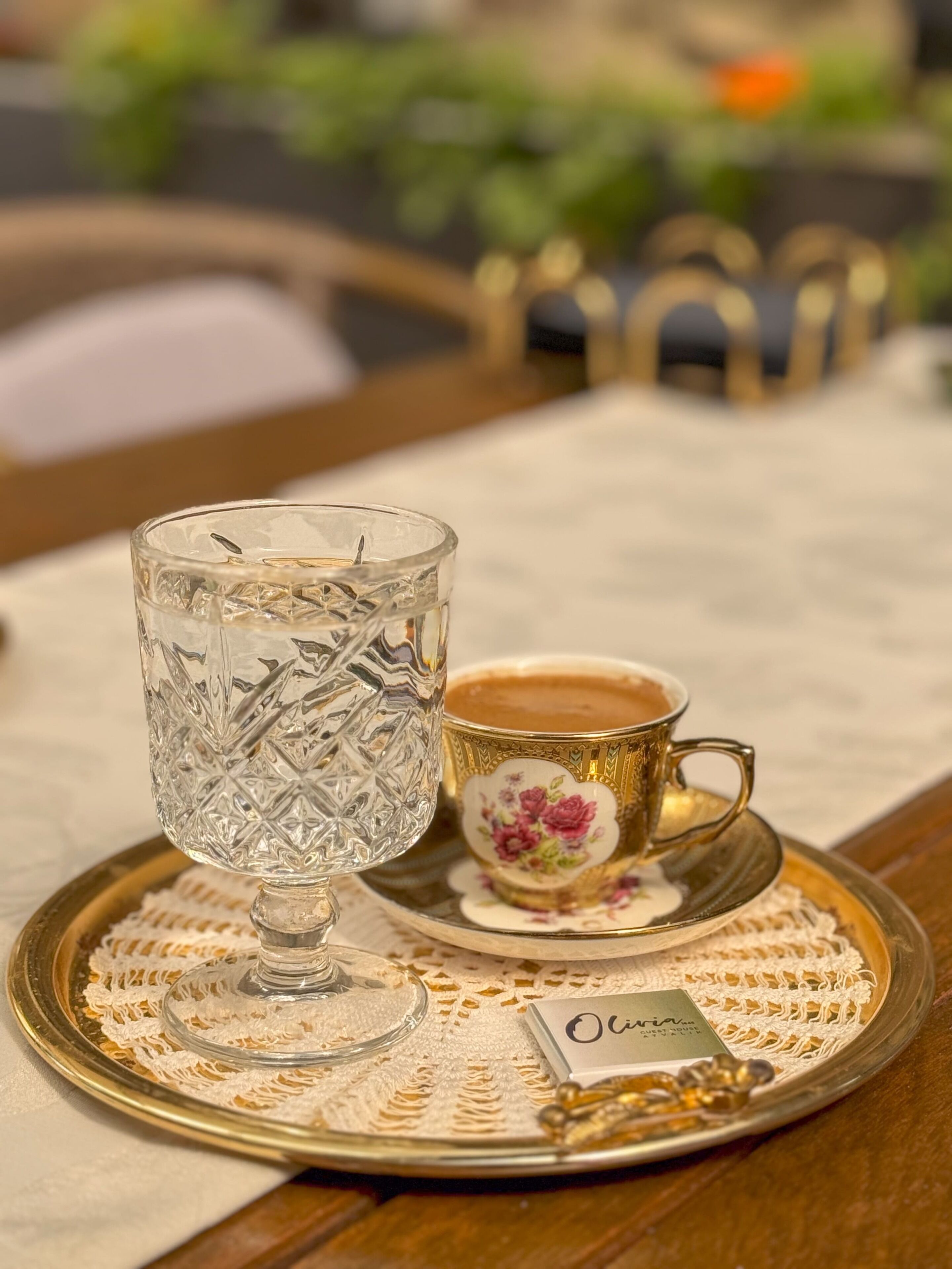 A tray with a glass and a cup on a table.