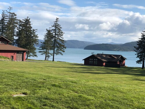 Beautiful farmhouse overlooking water with beach access on a private estate