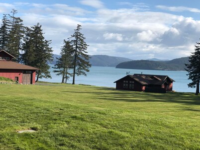 Beautiful farmhouse overlooking water with beach access on a private estate