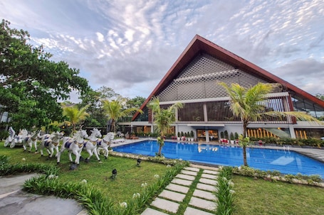 Outdoor pool. Ramada by Wyndham Yogyakarta