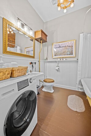 Bathtub, hair dryer, towels