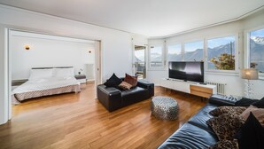 Deluxe Apartment | Living area | 100-cm LCD TV with digital channels, TV, DVD player - Spacious Panoramic Penthouse in Montreux (Montreux)