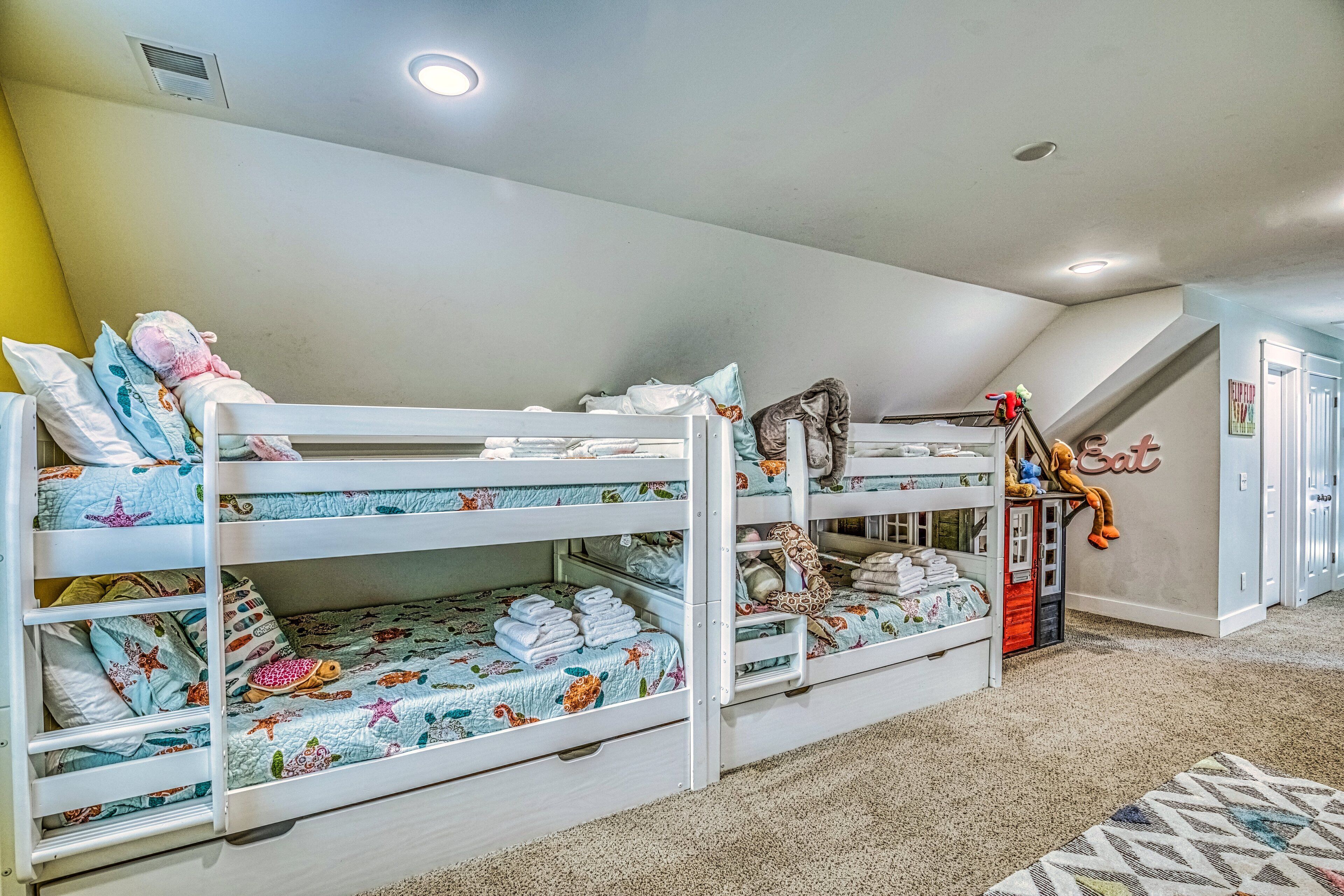 A bunk bed room with a toy figure on the top bunk.