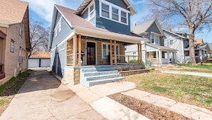 A two-story house with a front porch, a garage, and a well-maintained lawn. - 3 Bed 2 Bath by College Hill w/ Fitness Room (Wichita)