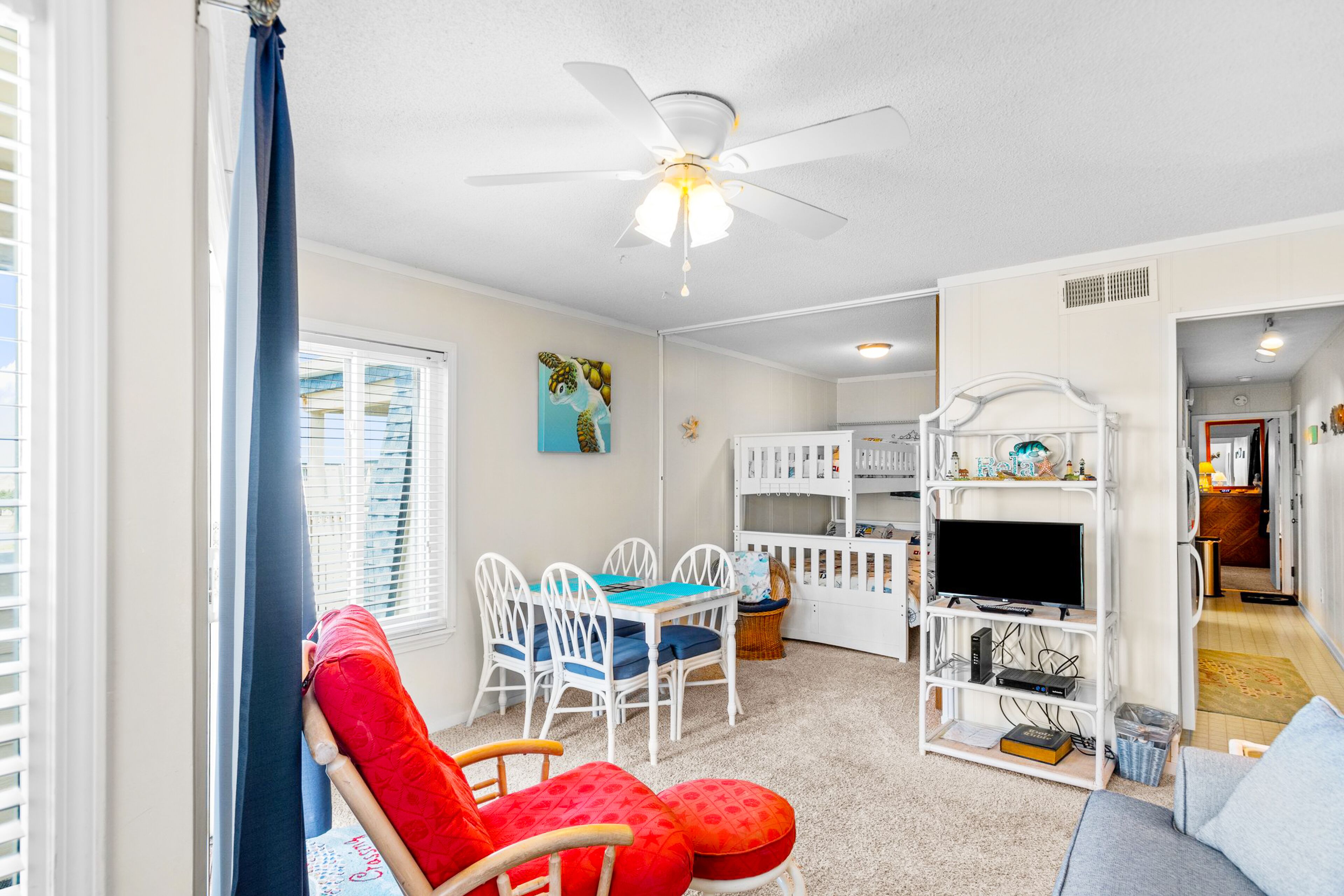 Ocean-view condo with beach access, pool, sports courts, & private balcony