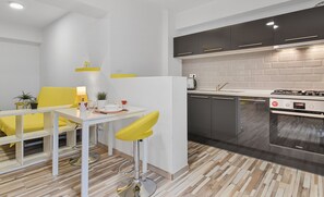 Comfort Suite | Private kitchen | Full-size fridge, electric kettle, cookware/dishes/utensils