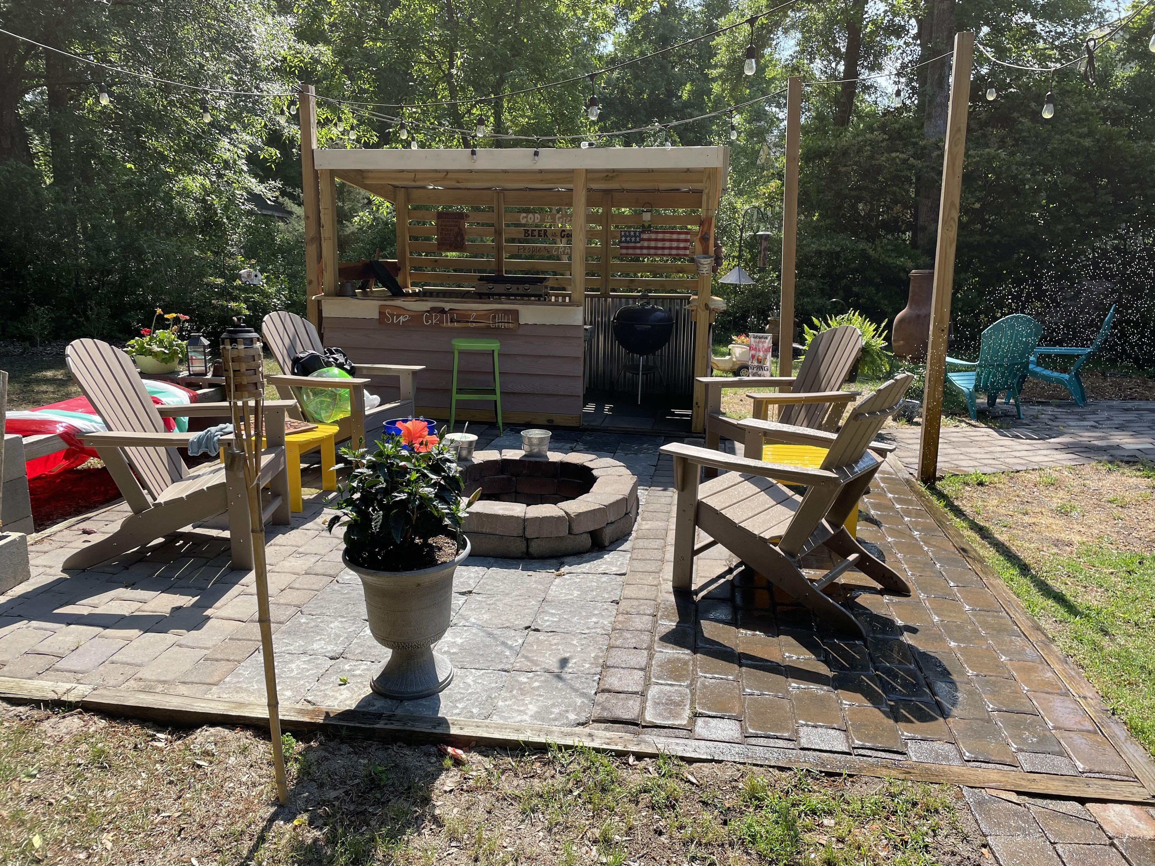 Outdoor patio with fire pit, bar/cook shack with Weber grill