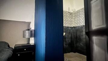 Panoramic Room | Bathroom | Rainfall showerhead, designer toiletries, hair dryer, slippers