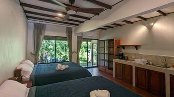 Basic Quadruple Room, 2 Queen Beds, Non Smoking, Garden View | In-room safe, blackout drapes, free WiFi, bed sheets