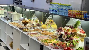 A buffet with various food items and beverages. - RETRO PALACE (Tashkent)