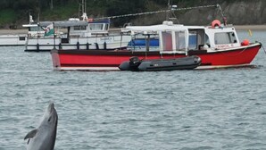 A boat named 'SEDMOR' and 'ERMOL 6' on calm water. - Synod Cottage | Private Hot Tub, Dog Friendly, Near New Quay (Ceredigion)