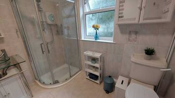 Shower, hair dryer, towels, shampoo