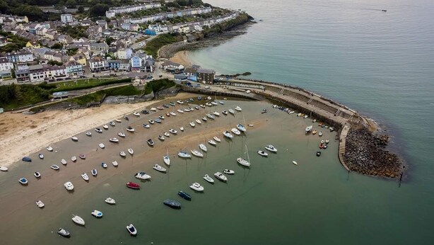 A coastal town with a marina filled with boats, a sandy beach, and residential buildings along the shore. - Pet-Friendly Country Escape HotTub & Log Burner (Ceredigion)
