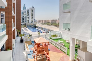 Terrace/patio - Upbeat 1BR at Pantheon Elysee Jumeirah Village Circle by Deluxe Holiday Homes (Dubai)