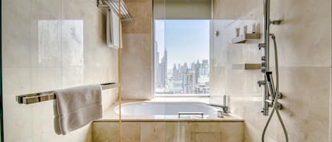 Bathtub, hair dryer, towels, soap