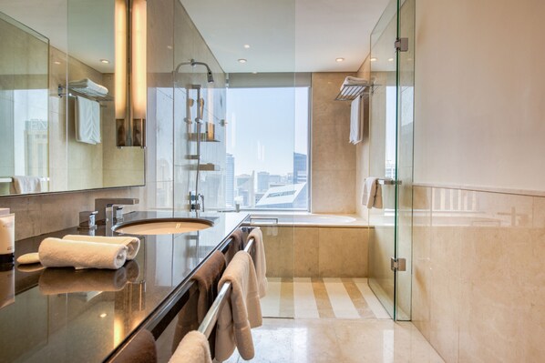 Bathtub, hair dryer, towels, soap