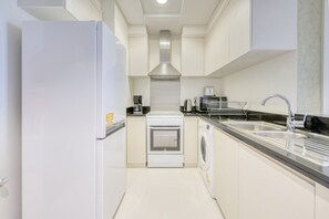 Fridge, microwave, oven, toaster - Prime 1BR at Carson B DAMAC Hills Dubailand by Deluxe Holiday Homes (Dubai)