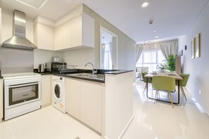 Fridge, microwave, oven, toaster - Prime 1BR at Carson B DAMAC Hills Dubailand by Deluxe Holiday Homes (Dubai)