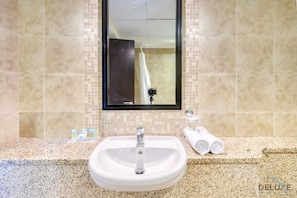 Bathtub, hair dryer, towels, soap