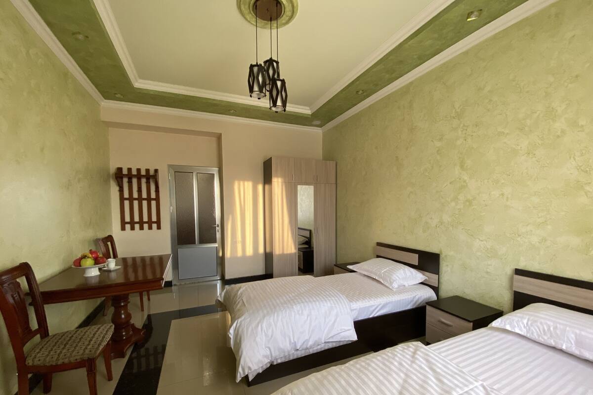 Economy Twin Room | Desk, WiFi (free), bed sheets