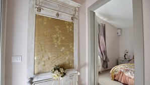 A bedroom with a bed, a nightstand, a dresser, and a mirror. - 2 bedroom stunning home in Camaiore (Camaiore)