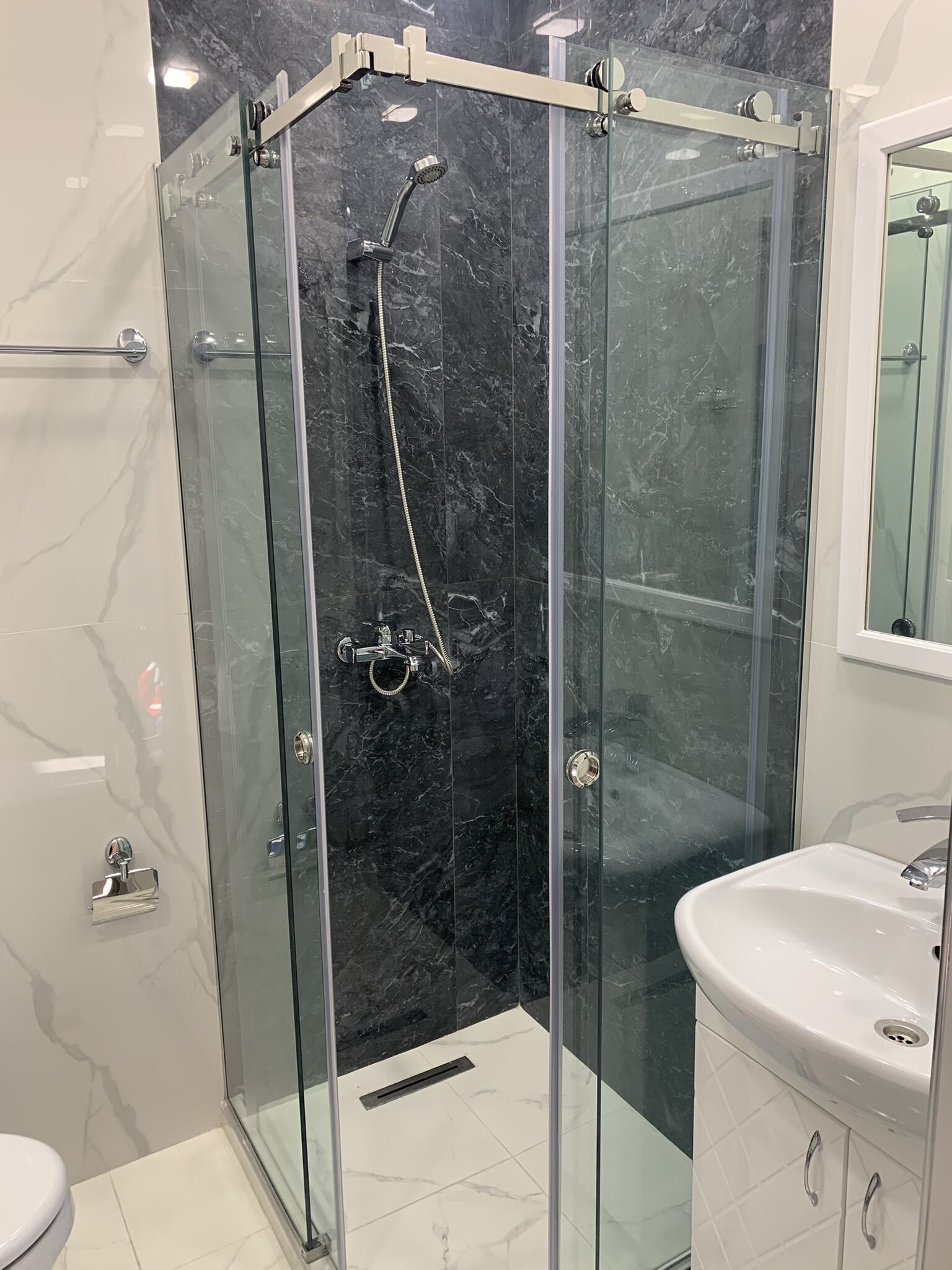 Shower, hair dryer, towels, toilet paper