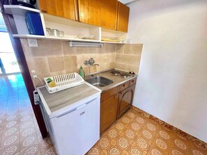 Fridge, stovetop, cookware/dishes/utensils