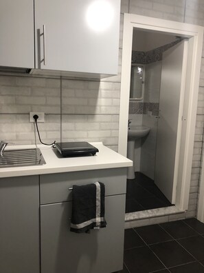 Panoramic Room | Private kitchen | Full-sized fridge, electric kettle, cleaning supplies, dining tables - Ottieri Apartment Napoli (Naples)