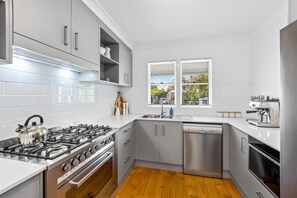 Fridge, microwave, oven, stovetop - Driftwood Mudjimba-Beach Holiday (Sunshine Coast)