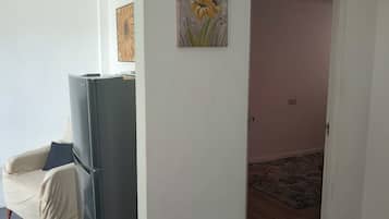 Apartamento empresarial | Área de estar | Smart TV 43 polegadas com canais digitais, TV, Netflix
