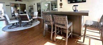 Great location..Climate-controlled lanai & NEW 2024 4-SEATER GOLF CART INCLUDED!