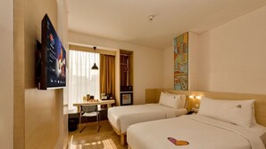 A hotel room with two beds, a desk, a TV, and a painting on the wall. - MaxOneHotels Premier Melawai (Jakarta)