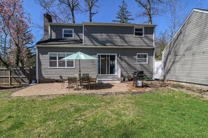 Enjoy a home away from home with a patio area featuring a table and chairs, perfect for relaxing.