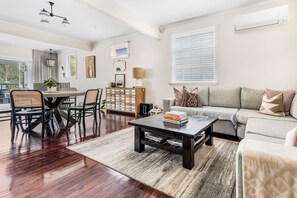 Relax in this inviting living space with a dining area, comfortable seating, and ample storage.