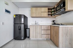 Fridge, microwave, stovetop, coffee/tea maker