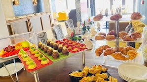 A buffet with various pastries, fruits, and desserts. - Boun's Hotel Resort & Spa (Yaoundé)