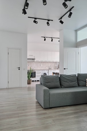 Superior Quadruple Room | Premium bedding, blackout drapes, iron/ironing board, free WiFi. Seven City Apartments